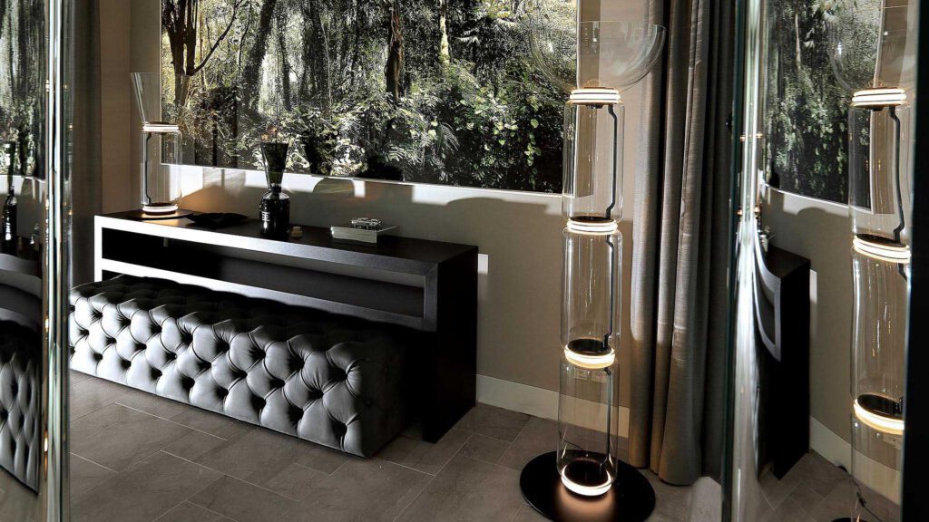 Corridor area in Nº3 Schinkelplatz in Berlin-Mitte with sideboard, designer lights and large-format art