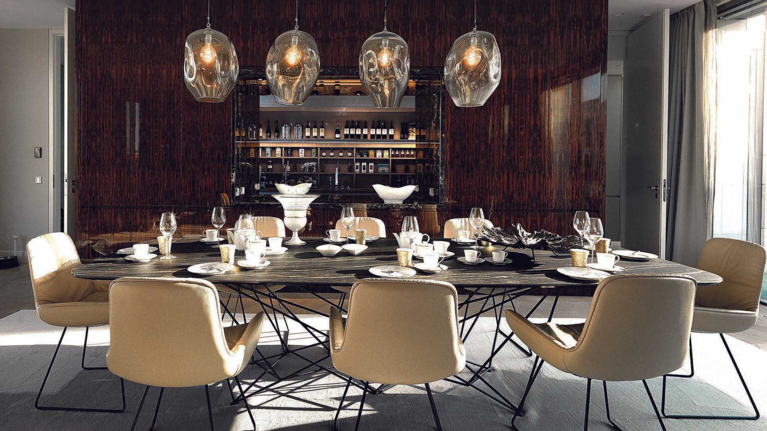 Large dining area at Nº3 Schinkelplatz in Berlin-Mitte with designer lighting and integrated bar