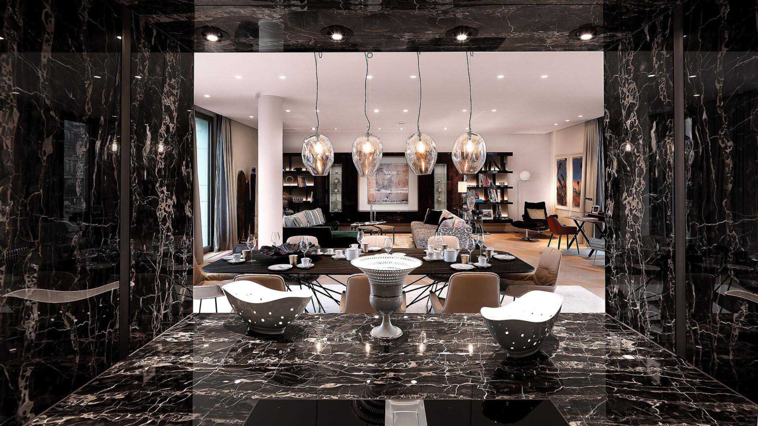 Open kitchen in Nº3 Schinkelplatz in Berlin-Mitte with dark natural stone and view into the living area