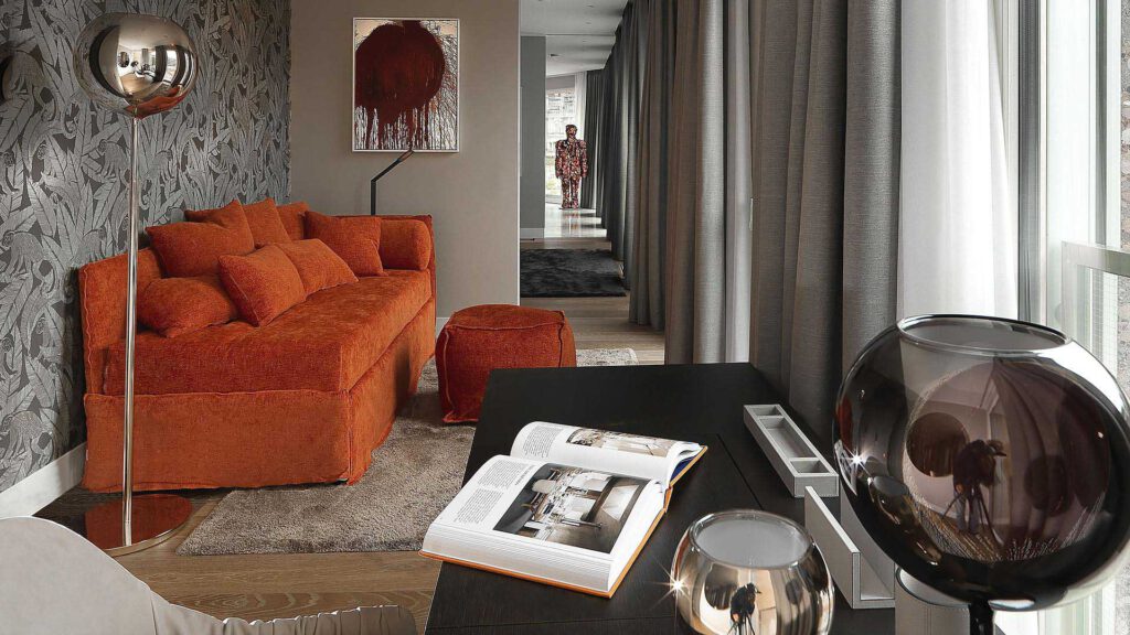 Living area in Nº3 Schinkelplatz in Berlin-Mitte with designer sofa, artwork and view into the hallway