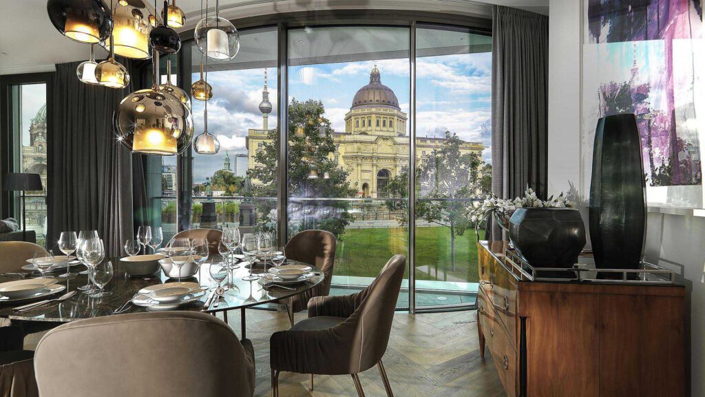 Dining area at Nº3 Schinkelplatz in Berlin-Mitte with designer lights and a view of the Berlin City Palace