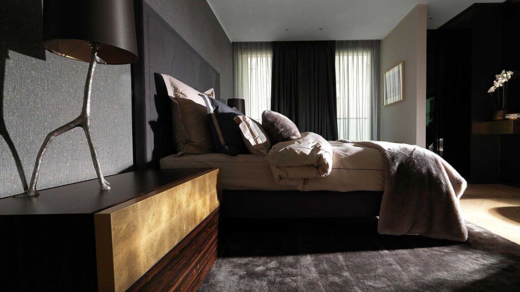 Bedroom at Nº3 Schinkelplatz in Berlin-Mitte with dark interior and elegant furnishings